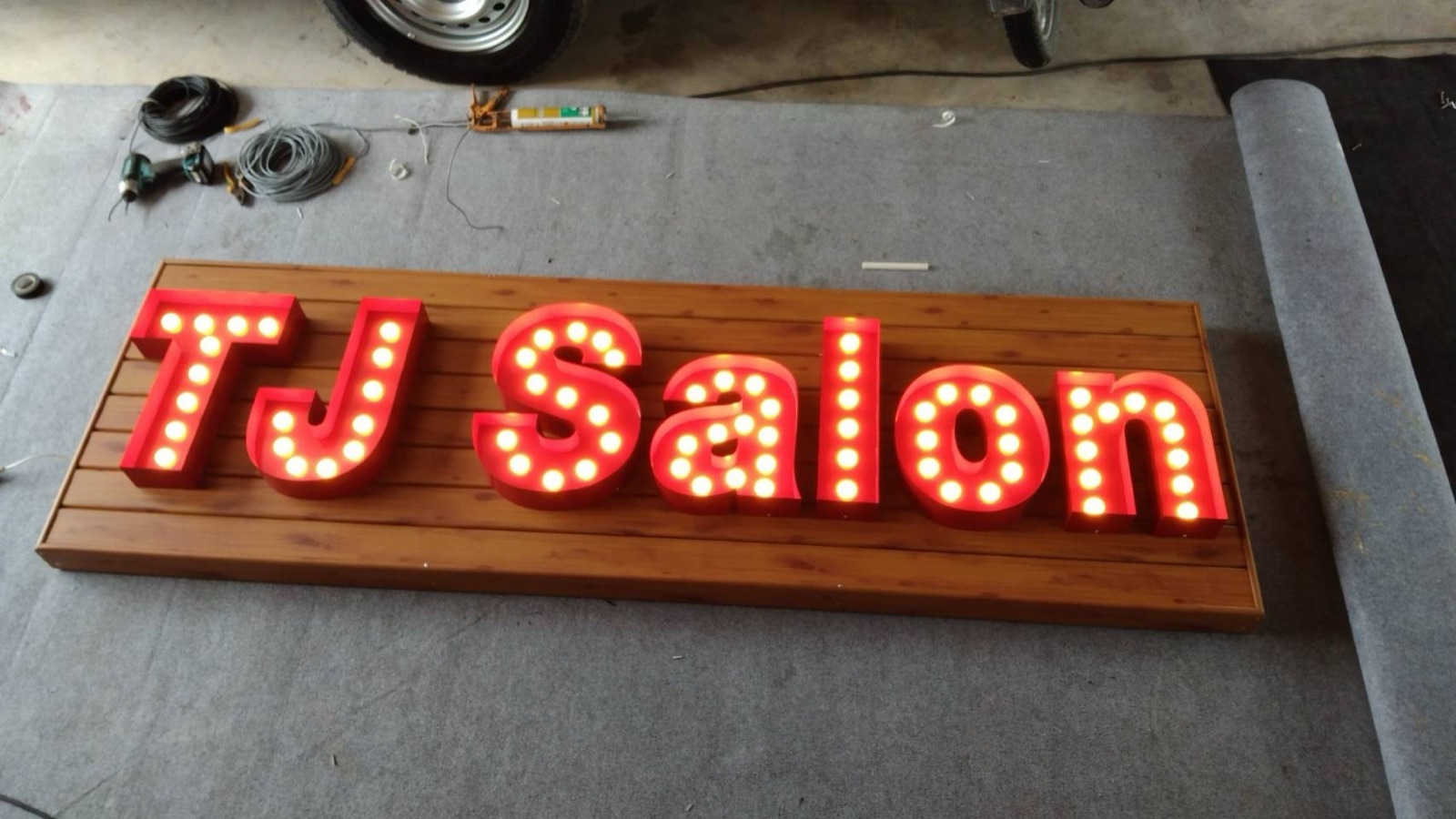 TJ Salon marquee bulb letters in the Mommy Signage workshop